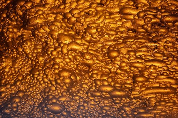 Macro view of flotation froth structure showing aggregated fine particles.