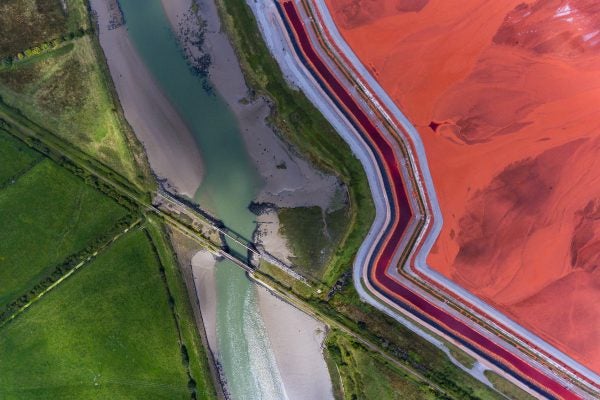Alumina refinery tailings and Bayer process landscape illustrating alumina production environment.