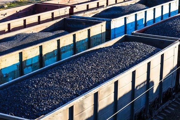 Rail wagons loaded with wet ore treated to prevent freezing and sticking.