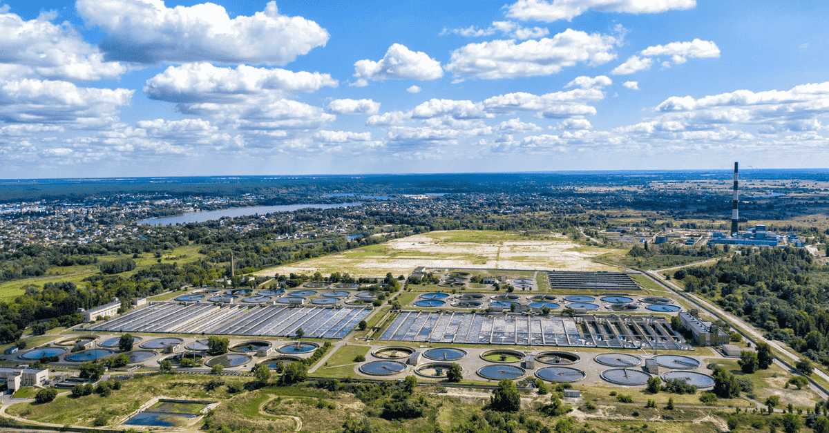 Aerial photo of water treatment facility showing clarifiers and treatment tanks