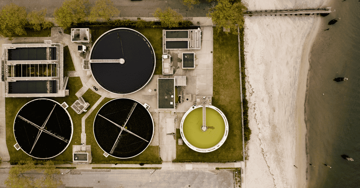 Aerial photo of a municipal water treatment plant with multiple clarifiers